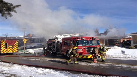 Crews battle house fire in Cambridge